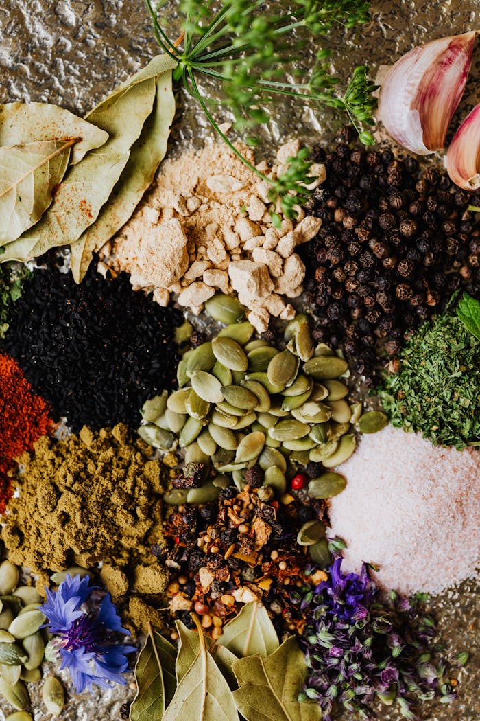 A colorful and aromatic assortment of spices and herbs, showcasing ingredients for cooking and culinary art.